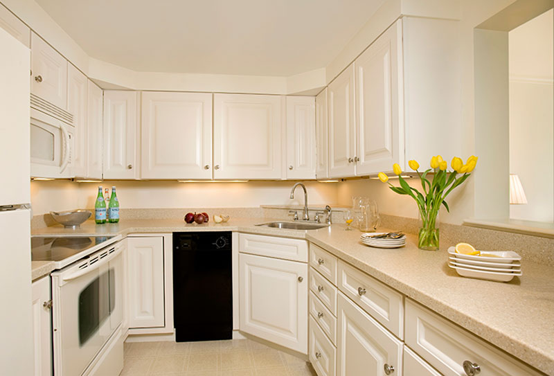 Kitchen with white cabinets and appliances