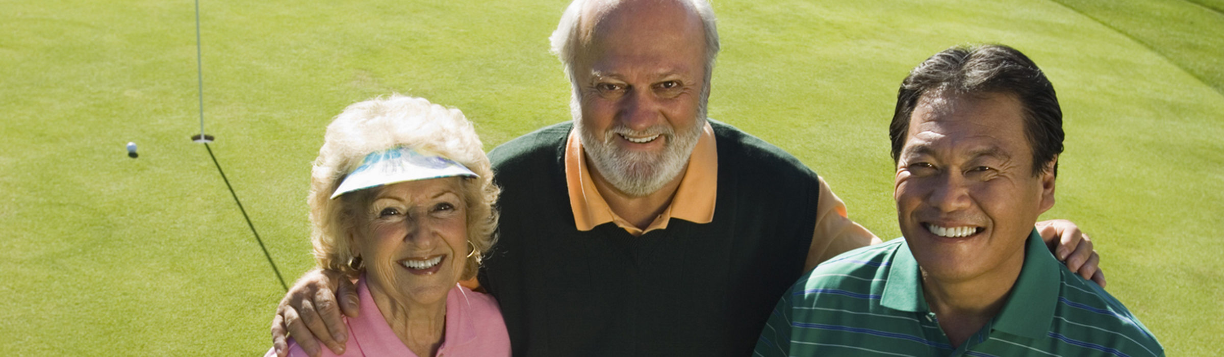 Three friends on a golf course