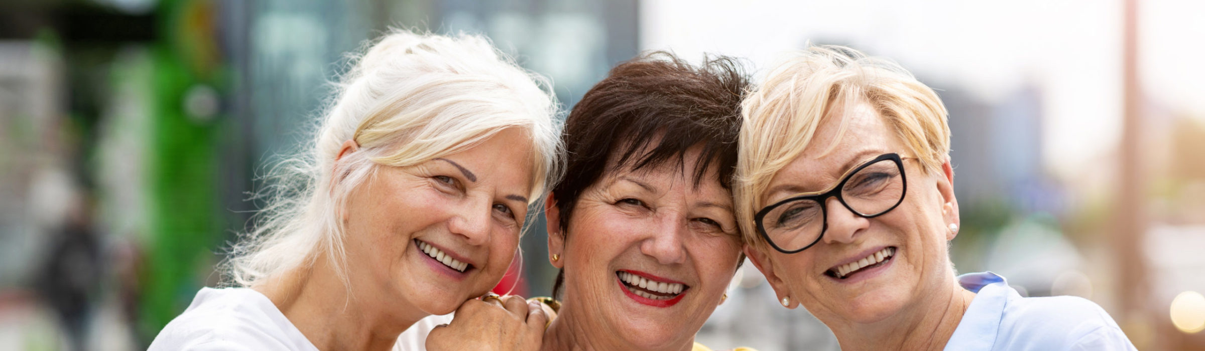 Three retirement living senior female friends having good time together