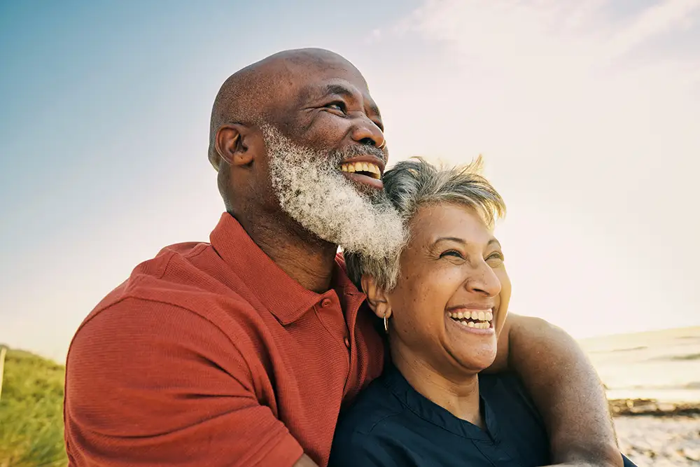 Active Mature African-American Couple Enjoying Retirement and Each Other’s Company at the Beach.