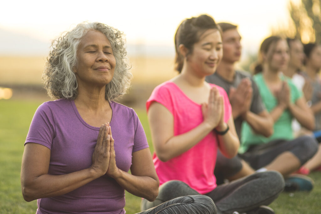 Management of Anxiety in the Elderly: Practical Approaches To Support Mental Wellness 3 senior woman with a group of people meditating