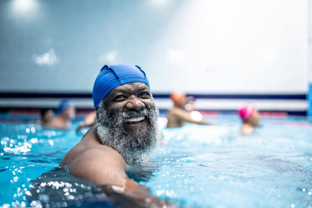 Swimming for Seniors: Stay Active Without Strain 5 happy swimming senior